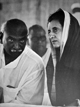 Indira Gandhi Prime Minister of India speaks with a Congress party colleague.