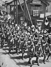 Celebratory parade by Japanese soldiers before embarkation to Manchuria