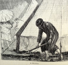 a soldier lays tar or felt to seal the base of the tent to stop water leaks