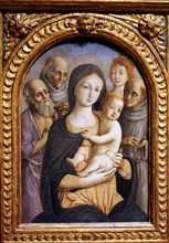 The Virgin Child with Four Saints by Pietro Orioli .
