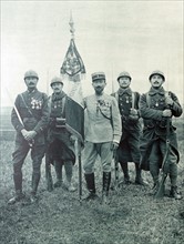 Lt Colonel Rollet holds a French Foreign Legion banner during WWI