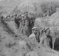 Greek soldiers guard captured Bulgarian troops in a trench in WWI