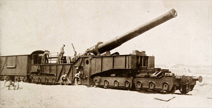 Large british artillery cannon mounted on a railway carriage for deployment during WWI