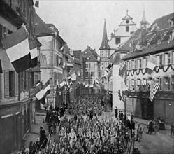 French troops march through a town liberated in WWI
