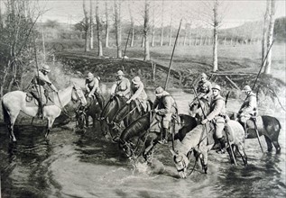 French cavalry horses drink at a river