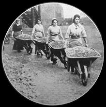 Women doing war work. Loading coal at Coventry;   England during WWI 1916