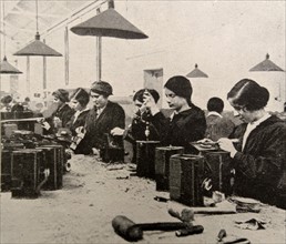 Women doing war work. Assembling naval signal lamps;   England during WWI 1916