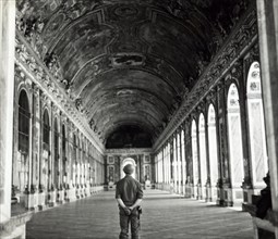 American soldier Versailles standing in the hall of mirrors 1944.