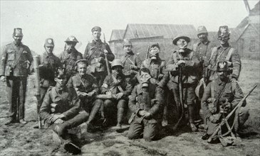 British soldiers wear German helmets captured in battle: WWI 1916