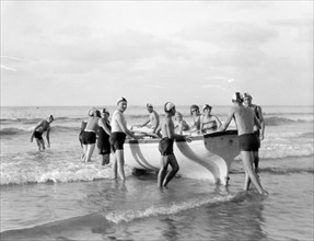 Zionist activities around Haifa. Members of Hapoel Club off for boat drill; 1930