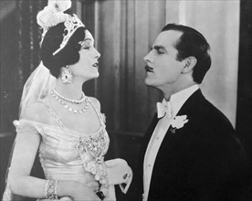 Hauteur at its height.  The studio caption says "Lord St. Austel (Antonio Moreno) tells his bride (Pauline Starke) that she has discredited the family name, in a scene from Love's Blindness, 1926, an ...