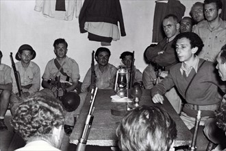 Photograph of Kibbutz members at a military briefing at Yad Mordechai