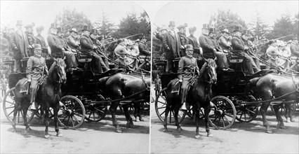 President McKinley and others in a horse-drawn carriage.