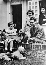 The Royal family with their pet dogs.