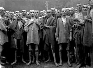 Male prisoners celebrating their survival in a concentration camp.