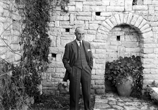 Sir Harold MacMichael at a sunken garden in his residency