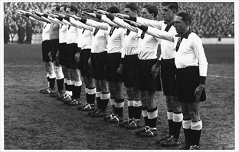 1936, Germany Versus England. German team give the Nazi salute at the Berlin Olympic games