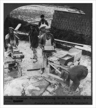 Russian peasants making brick by hand, Warsaw, Poland 1905.