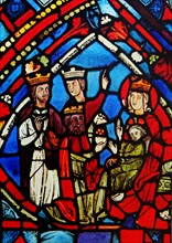 Stained glass window depicting the adoration of the Magi. Dated 13th century.