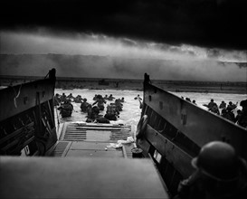 Photograph of U.S Troops rushing to the Normandy Beaches