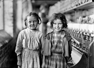 Photograph of two child workers working in the Tifton Cotton Mills