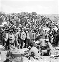 Photograph of a crowd of people at a market