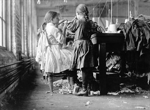 Photograph of two child workers working in the Loudon Hosiery Mills