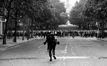 Photograph of police using tear gas against demonstrators