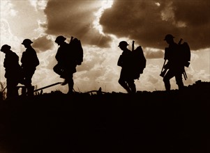 Photograph of Five Soldiers silhouetted against the sky at the Battle of Broodseinde
