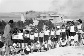 Photograph of Jewish School children on Carmel slope in the background