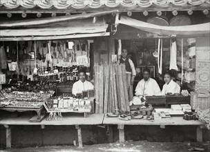 Photograph of Korean shopkeepers at their stores