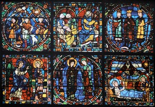 Stained glass window from above the main entrance to Chartres Cathedral, France. Shows the life of Christ: