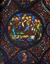 Stained glass window from the south aisle in Chartres Cathedral, France. death of the Virgin