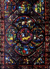 window from Bourges Cathedral, France. Shows the parable of the prodigal son;