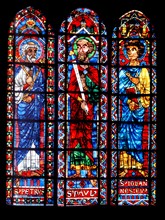Stained glass Bourges Cathedral, France. the Apostles; Peter, Paul and John;