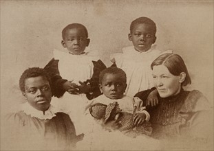 Mary Slessor (1848-1915) was a Scottish missionary to Nigeria. Seen here with some of her native friends of Calabar in West Africa.