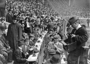 Reporters sending their reports via telegraph from a baseball game, at the Polo Grounds, in New York City,