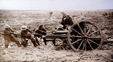 World war one British artillery gun is hauled through mud into a firing position 1915