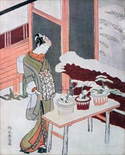 Harunobu: Young woman watches snow covered flowers 18th Century Japanese