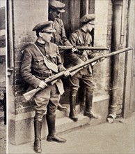 Photograph of armed soldiers guarding the four court after the battle of the four courts