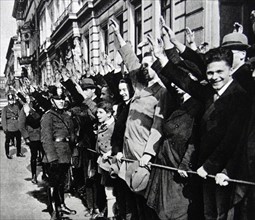Photograph of German youths saluting in support of Adolf Hitler