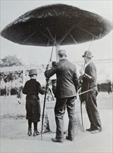The mushroom head protector used in an archery contest, Belgium 1914.
