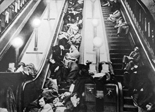 London underground escalators packed with people sheltering from an air raid in world war two 1941