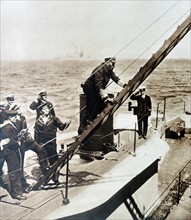 Photograph of King George V disembarking from a submarine