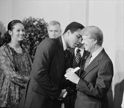 Photograph of President Jimmy Carter greeting Mohammed Ali at a White House Dinner