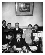 Photograph of Russian Foreign Minister Vyacheslav Molotov with German Minister Von Ribbentrop and Josef Stalin