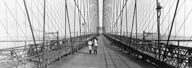 Photograph of Children walking across the Brooklyn Bridge