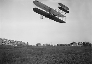 Photograph of Orville Wright piloting an early aeroplane