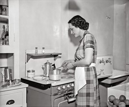 Mrs. Claude Pepper at her oven