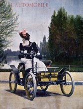 An 1899 Decauville Voiturelle motorcar driven by a woman
